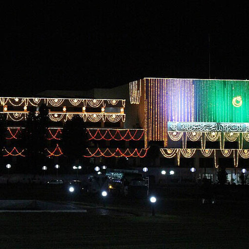 Pakistan’s Parliament House glowing with lights on the evening before Independence Day 2018