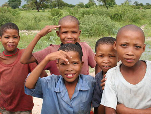 San boys in a village close to Tsumkwe, Namibia, play during the rainy season, while grappling with the effects of maldevelopment and malnutrition
