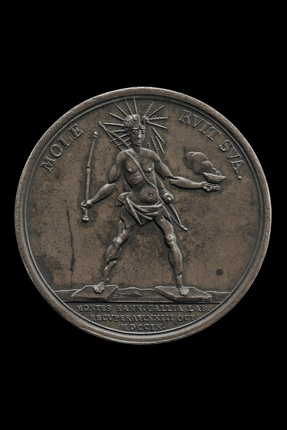 Colossus of Rhodes, 1709, Louis is shown as the Colossus of Rhodes crumbling under its own weight. The medal celebrates the capture of Hainault from the French in 1709 and is representative of the widespread feeling that Louis’ pre-eminence was coming to an end © The Trustees of the British Museum
