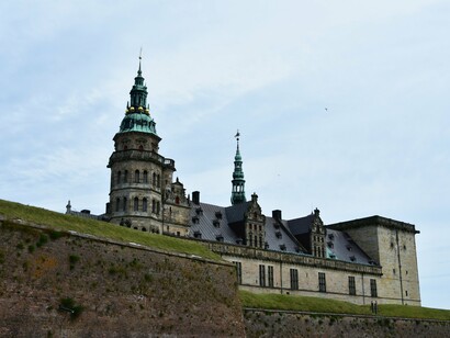 Kronborg Castle rises over the Øresund Strait, a Renaissance fortress whose strategic position once controlled maritime traffic between Denmark and Sweden