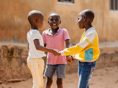 Children laugh and play together in their village, where digital tools and online learning remain a distant dream due to Africa’s infrastructure challenges