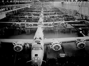 Production of B-24E (Liberator) bombers at Ford’s Willow Run Plant in Michigan. The image looks down one of the assembly lines where large numbers of aircraft were manufactured during the Second World War. Designed for long-range, high-altitude precision bombing, the B-24E Liberator saw extensive service across the Pacific, North Africa, Europe, and the Aleutian Islands. Source: Library of Congress