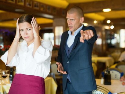 A restaurant patron is rude to the waitress