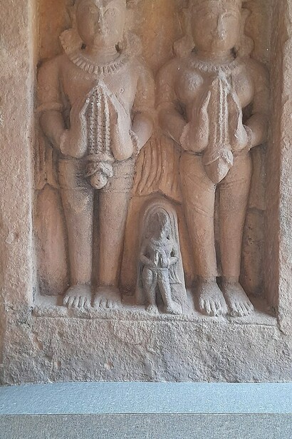 Three people in an artifact located in Gujri Mahal Museum, Gwalior, India  