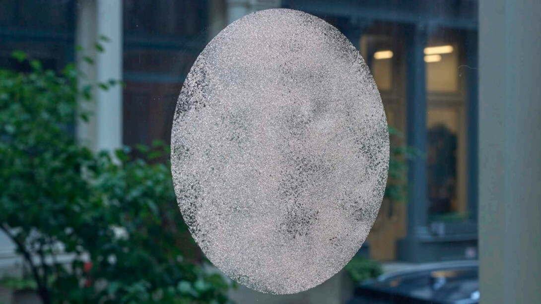 Gary-Ross Pastrana, Coin, 2014 - 2023, filed and sanded-down USA/Peso silver coin dust affixed to glass pane with gelatin, dimensions variable. Courtesy the artist and Jane Lombard, NYC