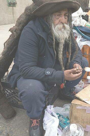 Homeless man stares into the distance 