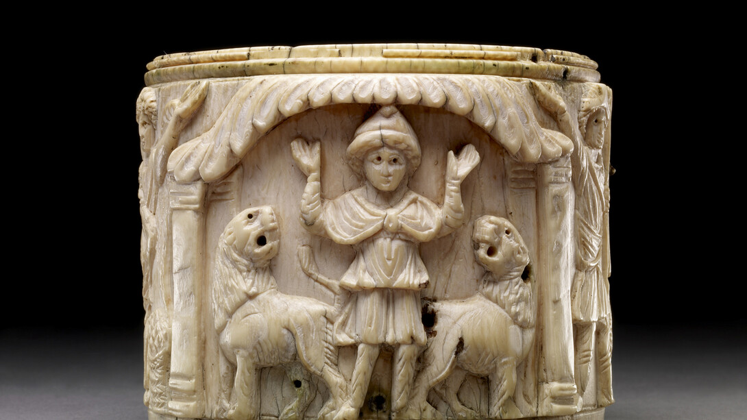 Ivory pyxis box depicting Daniel with arms raised in prayer is flanked by two lions, Egypt or Syria, 5th or early 6th century AD, © The Trustees of the British Museum