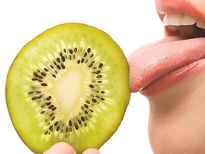 Capture the essence of taste exploration with an image featuring a woman savoring kiwi, highlighting taste buds, receptors, and sweet treats