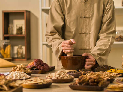 A man blending Ayurvedic spices with care and precision, embodying health, tradition, and professionalism