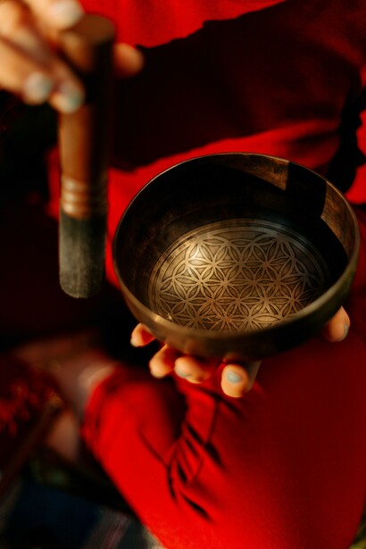 Person holding metal bowl