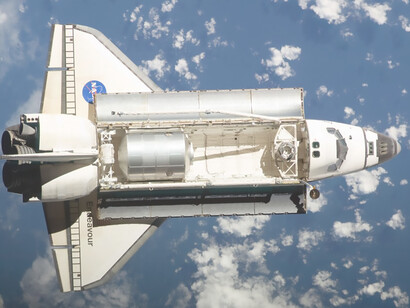The breathtaking sight of the Space Shuttle Endeavour gracefully soaring above the International Space Station—an iconic moment capturing the marvels of aerospace exploration and Earth's atmosphere