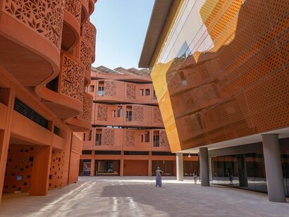 Located in Abu Dhabi, Masdar City integrates renewable energy and green architecture to reduce its carbon footprint
