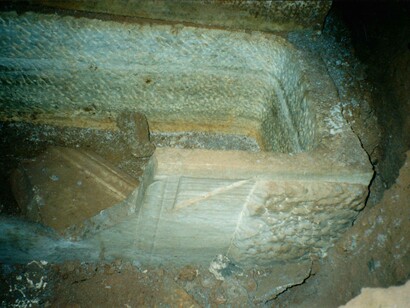Sarcophagus below trough in the back wall of a chamber in the catacombs of Vigna Randanini, Rome, Italy