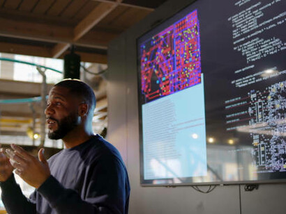 A man presents an engaging seminar on coding, sharing insights and practical skills to empower participants in the world of programming