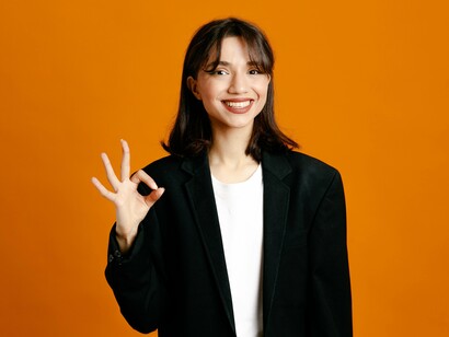 A composed professional signalling confidence and agreement, representing the expectation of emotional compliance in corporate spaces