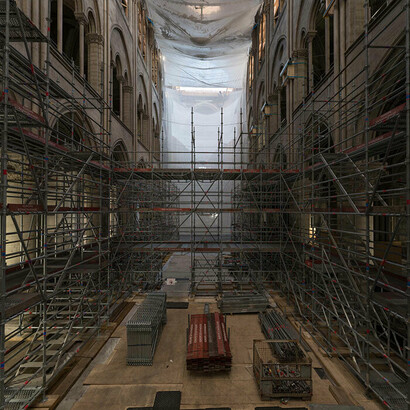 Internal view of scaffolding work inside Notre-Dame during rebuild.  Courtesy of Immigration Museum