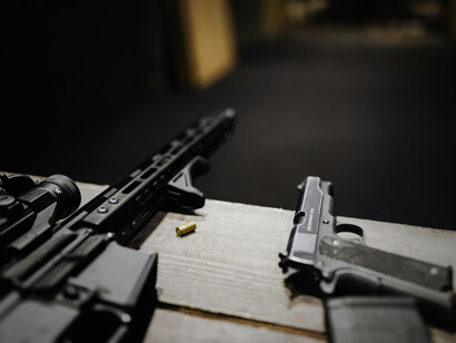 A close-up of firearms, reflecting the normalisation of force in global diplomacy