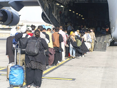 U.S. Airmen from the 821st Contingency Response Group board a C-17 Globemaster III at Travis Air Force Base, California, on August 14, 2021. In support of the Department of Defense, the U.S. Air Force deployed forces to Afghanistan to facilitate the safe evacuation and relocation of U.S. citizens, Special Immigrant Visa recipients, and vulnerable Afghan populations