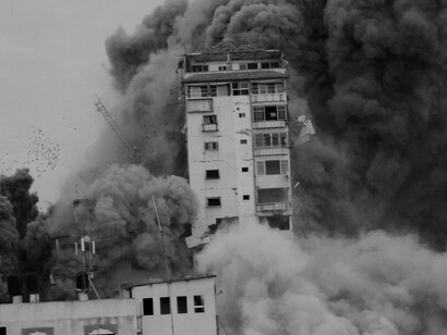 Smoke and flames billow after Israeli forces struck a high-rise tower in Gaza