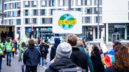 Man holding sign for the Fridays for Future Bonn, global environment protest, 2021