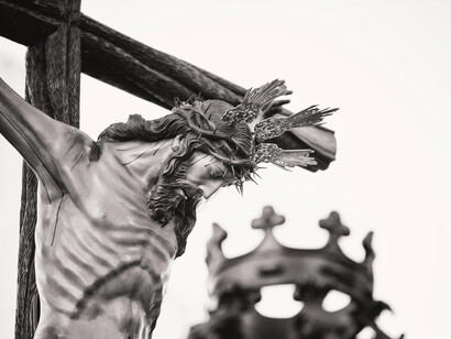 Grayscale photograph of a crucifix depicting Jesus in a church in Carmona, Andalusia, Spain