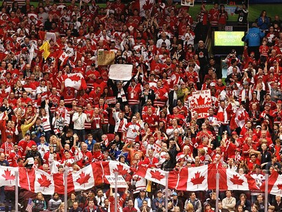 A sea of red-clad Canadian fans erupts as Corey Perry's second-period goal gives Canada a 2-0 lead over the USA, with half the game still to play during the 2010 Winter Olympics