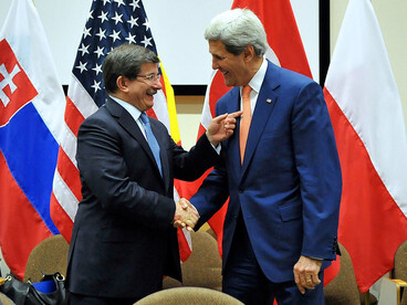 U.S. Secretary of State John Kerry and Turkish Foreign Minister Ahmet Davutoglu shake hands before a bilateral meeting amid a series of ministerial discussions at NATO Headquarters in Brussels, Belgium, on June 25, 2014