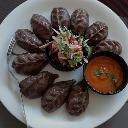 Kodho Momo, a special variety made with buckwheat (known as kodho), which grows in the highlands of Nepal. While momo is traditionally prepared with regular flour, this version combines two unique elements: the classic Newari dumpling and the earthy flavor of buckwheat