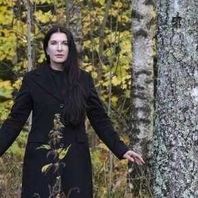 Marina in Black coat in the forest – Portrait of Marina Abramovic, © Knut Bry and Ekebergeparken Oslo, 2013