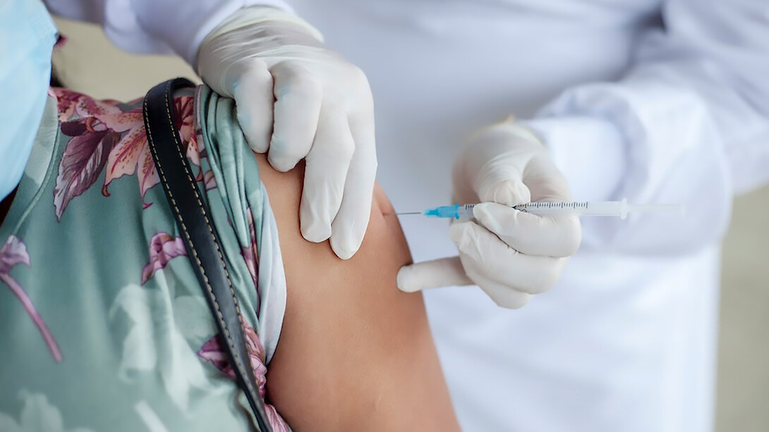 In Sucre, Colombia, a dedicated doctor administers a crucial vaccination to a patient in the rural village of Ovejas, exemplifying the importance of healthcare outreach in underserved communities