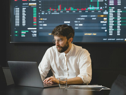 A stock exchange broker following updates and news