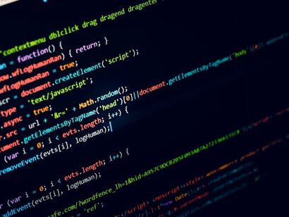 Vibrant hues of software and web code displayed on a computer monitor, igniting discussions on data privacy, legal responsibility, and technology ethics