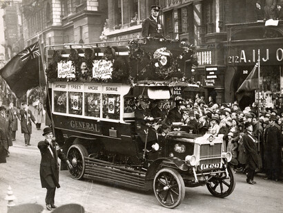 Ole Bill bus B43 flanked by standard bearers in the Armistice Day parade 1920