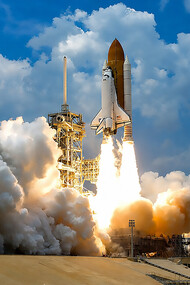 At NASA’s Kennedy Space Center in Florida, space shuttle Atlantis launches through clouds of smoke and steam on its STS-125 mission to service the Hubble Space Telescope. The 11-day mission included five spacewalks to upgrade Hubble with advanced scientific instruments and extend its operational life