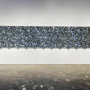 Robert Hickman, DMMDIA, 2014, mirror mosaic, 4' x 48'.  Photo by Etienne Frossard.  Image courtesy of Smack Mellon.
