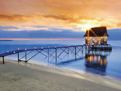 A romantic dinner setting by the beach