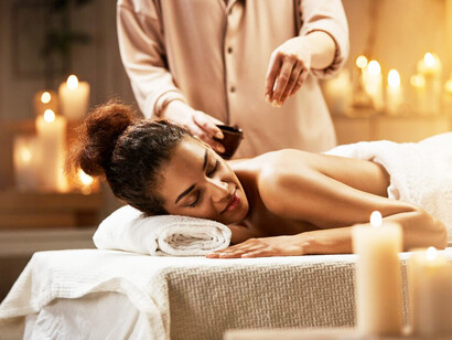 Through the ancient art of Ayurveda, this woman is receiving a personalised massage, designed to balance her doshas and enhance her well-being