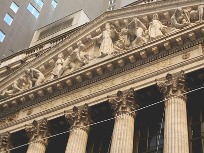 The global economic landscape is currently defined by a sharp rivalry between the declining hegemony of the United States' "free market" model and the state-capitalist framework of the expanding BRICS coalition.
New York Stock Exchange Broad Street facade