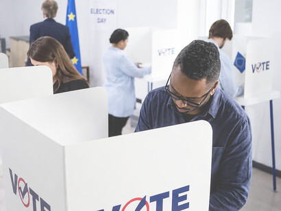 Citizens participate in European Union elections by casting their votes in polling booths
