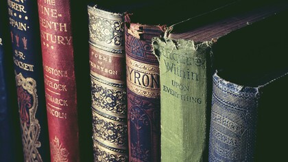 An intimate literary still life evoking HoleniaPoesia’s mission to recover forgotten voices, where aged books, manuscripts, and early twentieth-century journals turn poetry into memory, resistance, and rediscovery
