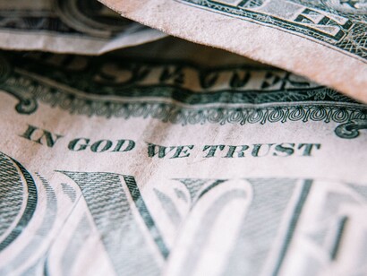 A one dollar bank note. A recession casts a shadow of concern over the global economy, triggering questions about its alarming potential