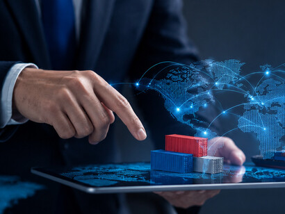 Global trade and logistics visualised through shipping containers and a world map, highlighting the networks that connect producers, consumers, and markets worldwide