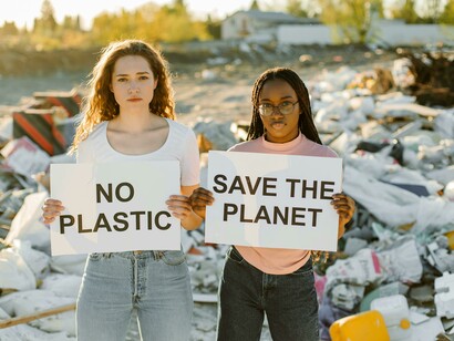 Young environmental activists protest against plastic pollution at a landfill 