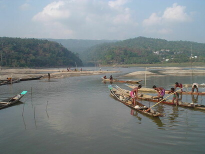 People on boats in Jaflong in the Division of Sylhet, Bangladesh. It is situated at the border between Bangladesh and the Indian state of Meghalaya. Jaflong is famous for being the home of the Khasi tribe