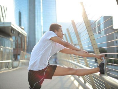 A man stretching before he begins his exercises