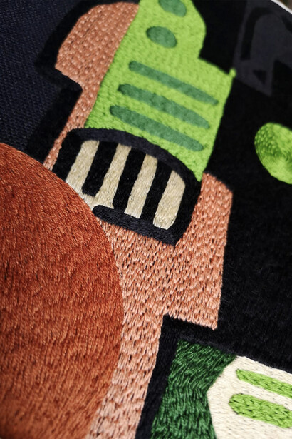 A close-up of a Kazumi design and Sicilian hand embroidery 