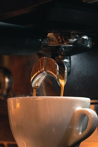 Turkish coffee being poured into a cup