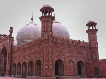 The Badshahi Mosque (Punjabi: شاہی مسجد, śāhī masīt; Urdu: بادشاہی مسجد, bādshāhī masjid) is an imperial Mughal-era mosque in Lahore, Punjab, Pakistan. Built between 1671 and 1673 under the reign of Emperor Aurangzeb, it stands opposite the Lahore Fort on the northern edge of the historic Walled City