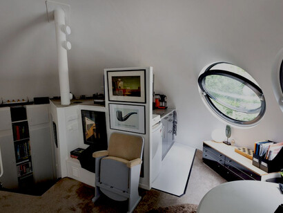 In the Maaspoort district of ’s-Hertogenbosch, Netherlands, Bolwoningen features 50 futuristic sphere-shaped houses positioned close to a canal