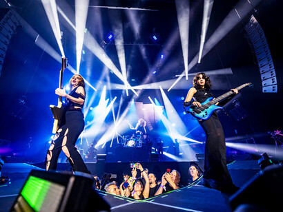 Alejandra and Daniela of The Warning captivate the crowd with their intense guitar performance, blending technical prowess with heartfelt passion